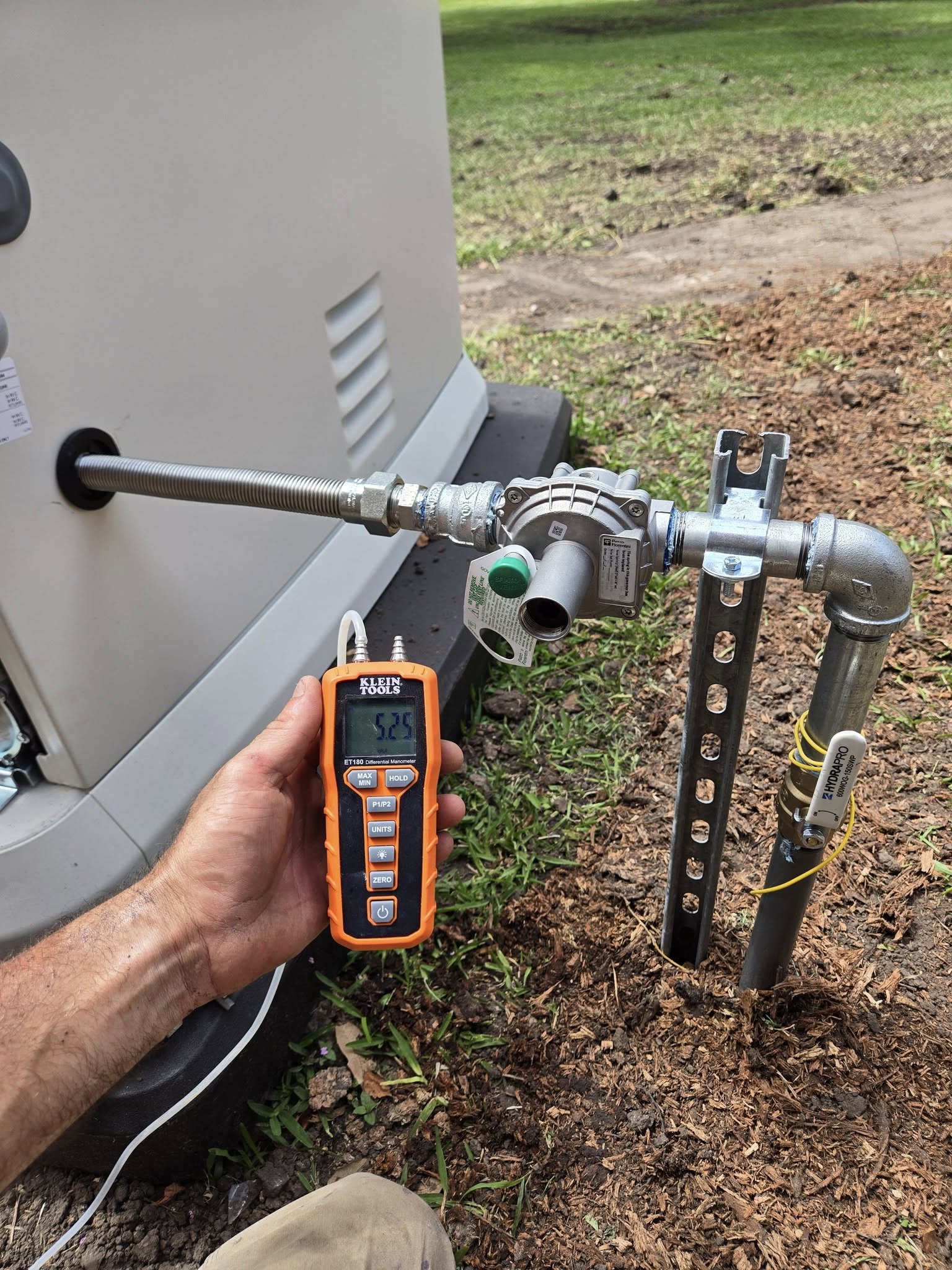 Gas leak detector reading during a pressure test at a generator gas line connection.